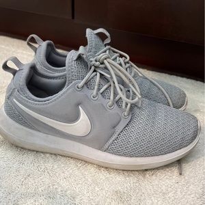 Gray and white Nike gym shoes size 6